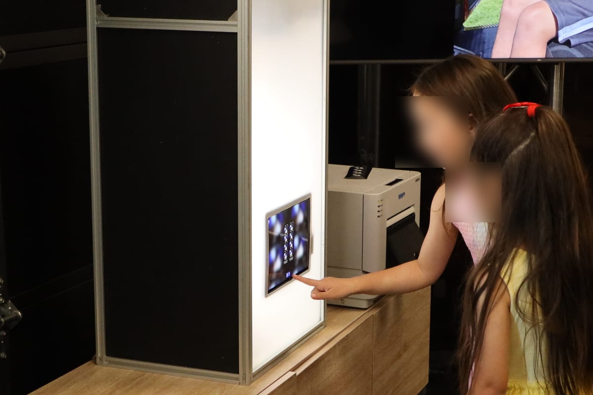 Guests using the touchscreen on the H7 photo booth